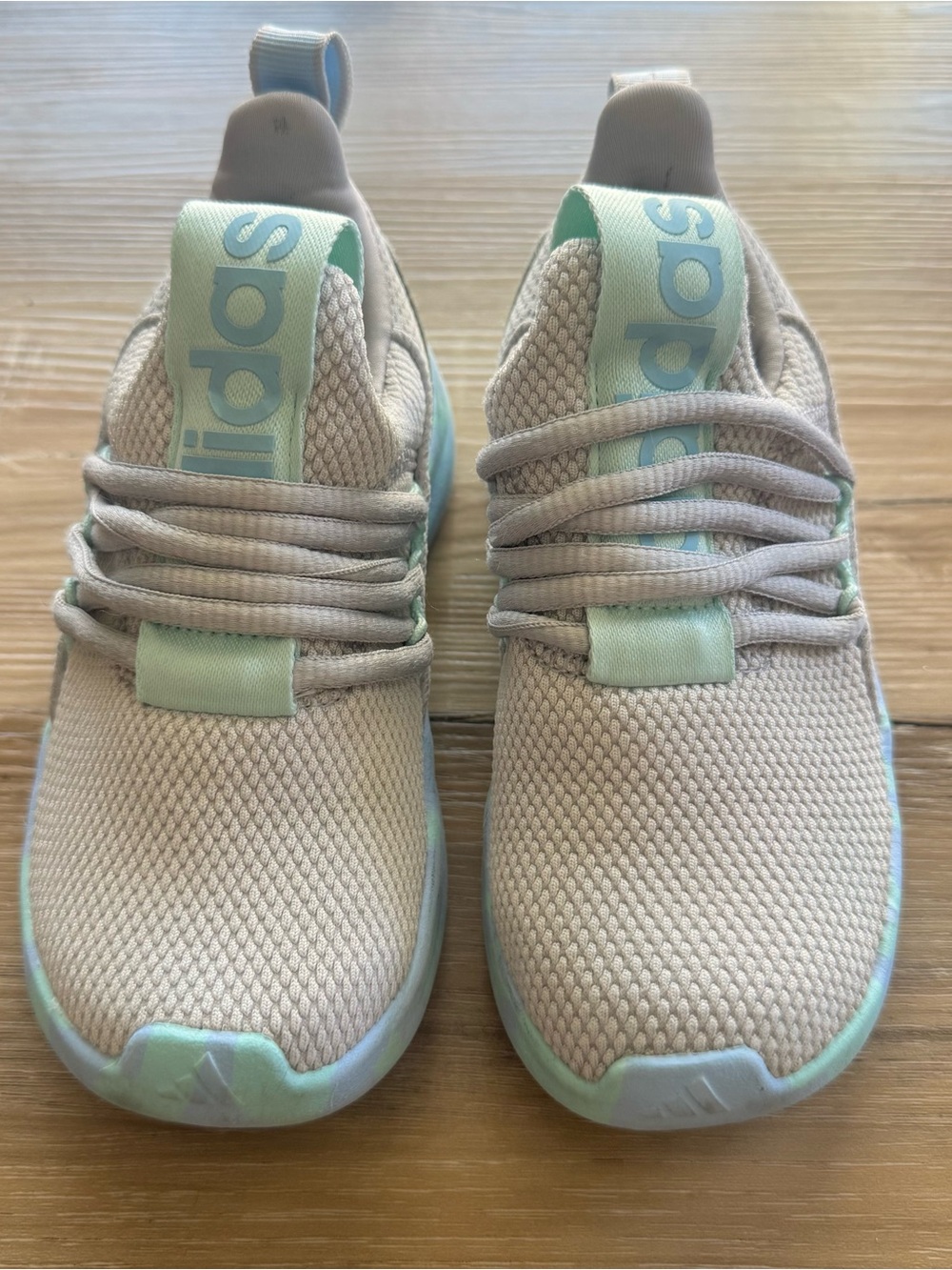 Kids Lite Racer Adapt shoes in a light blue and grey
